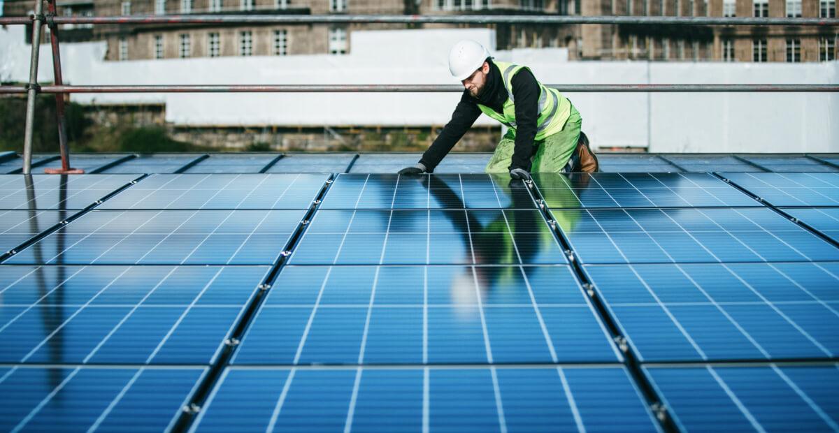 Maintenance worker inspecting panel