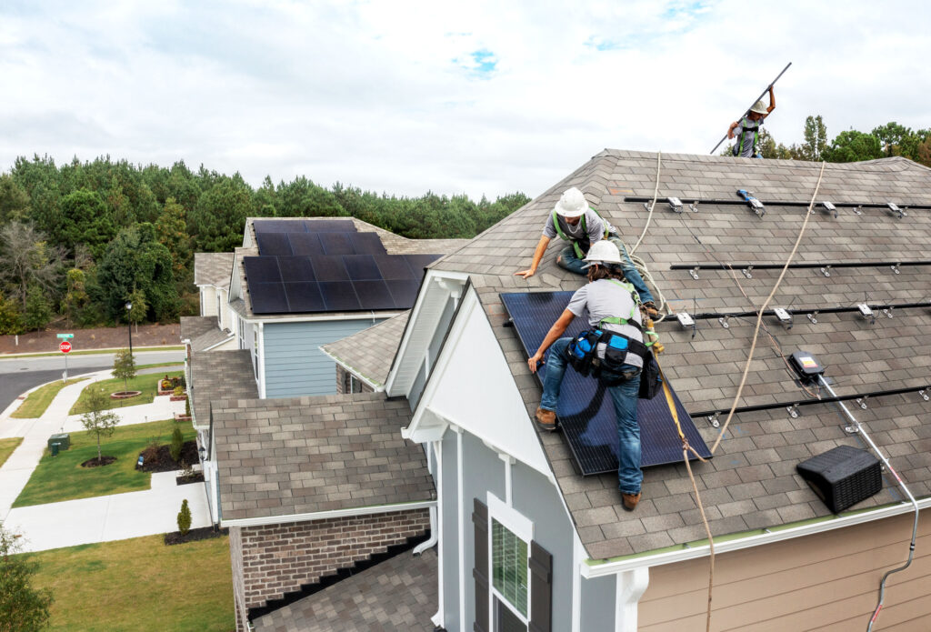 images that illustrate the working process of installing solar panels